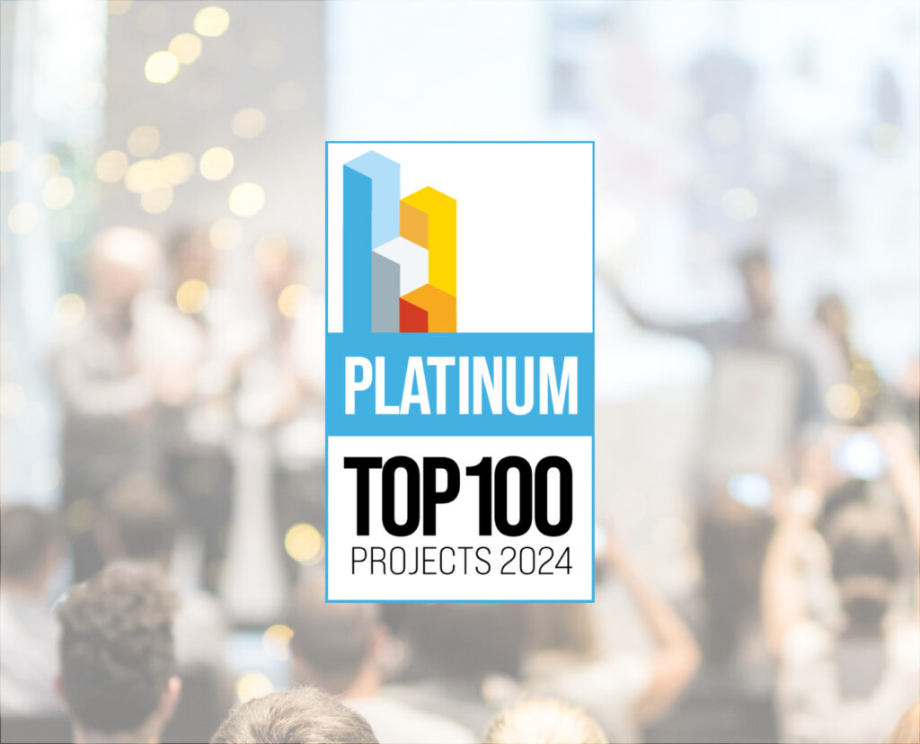 A graphic featuring the "Platinum Top 100 Projects 2024" logo, with a blurred crowd in the background.